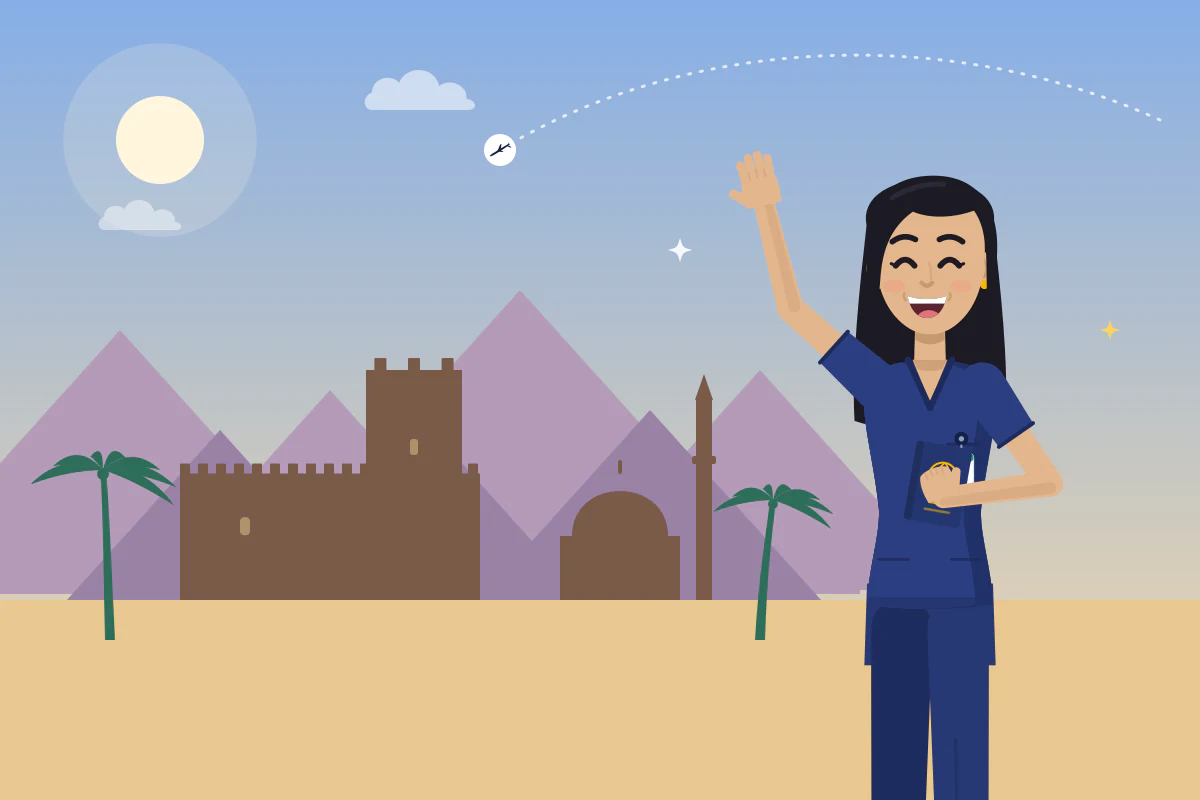 A smiling nurse waves in front of an old fort, a domed building and mountains on a sunny afternoon.